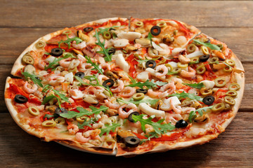 Sticker - Pizza with seafood, red pepper and olives on wooden table