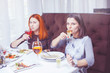 © 6okean - The girls are friends, drink in the restaurant.