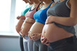 © pressmaster - Row of pregnant women