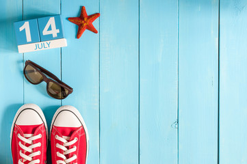 Wall Mural - July 14th. Image of july 14 wooden color calendar on blue background. Summer day. Empty space for text. Storming Of the Bastille Day