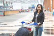 © Odua Images - woman in international airport