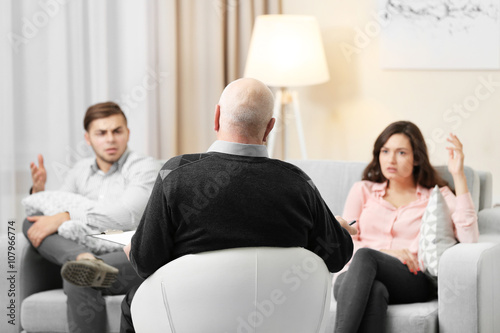 Fotografia, Obraz Young couple with problem on reception for family psychologist