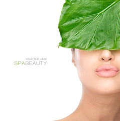 Wall Mural - beauty spa woman with a fresh leaf over face