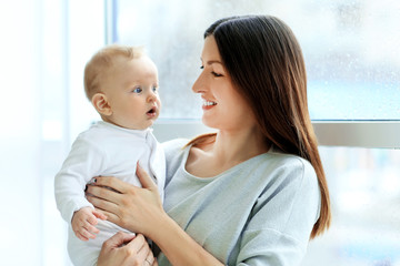 Wall Mural - Beautiful woman with baby boy, closeup