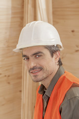 Wall Mural - Orange vested hardhat wearing contractor