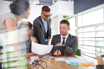 Wall Mural - team of successful business people having a meeting in executive sunlit office