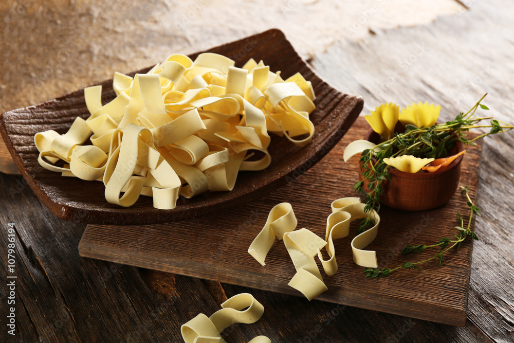 Raw pasta on cutting board