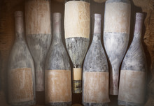 Aged Wine Bottles In A Wine Cellar