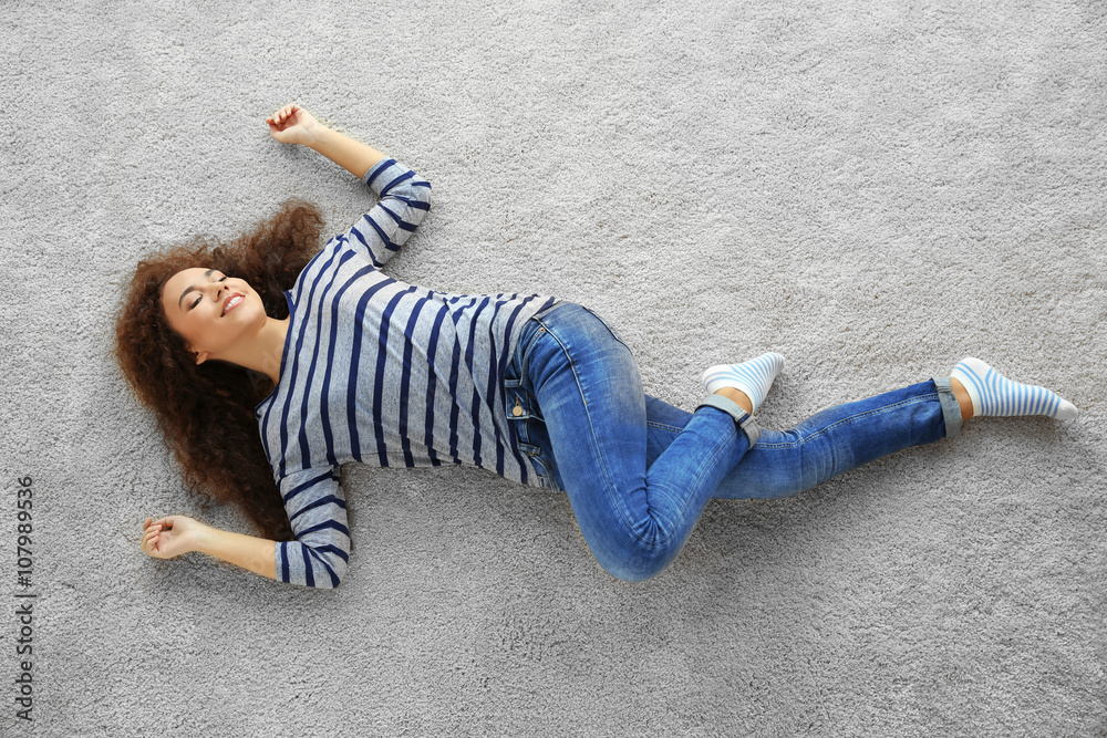 Young woman lying on the floor