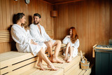 People relaxing in sauna