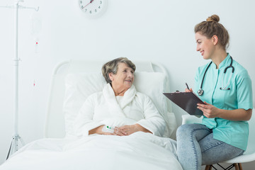 Wall Mural - Female doctor and ill senior