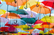 Colourful Umbrellas Hanging On The Sky