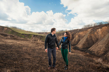  Happy couple smiling outdoors in the mountains