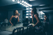 © Inti St Clair/Blend Images - Black woman applying makeup in vanity mirror