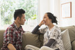 © JGI/Tom Grill/Blend Images - Couple talking on sofa in living room