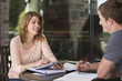 © Jeff Greenough/Blend Images - Caucasian students studying at table
