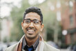 © Inti St Clair/Blend Images - Indian man smiling in city