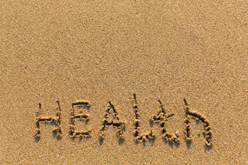 Wall Mural - Health - drawn of the hand on the beach sand.