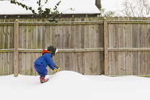 Boy Playing In Snow