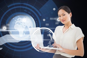Poster - Composite image of asian businesswoman using laptop