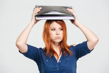 Tired Sad Young Woman Standing With Folders On Her Head