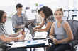 © JGI/Tom Grill/Blend Images - Businesswoman smiling in meeting