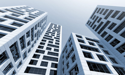 Wall Mural - Perspective of tall office towers under blue sky