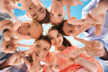 Canvas Print - happy children showing peace hand sign