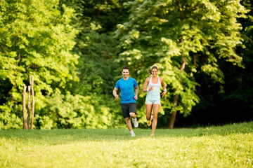 Young couple running