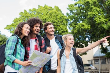 Poster - Friends holding map and pointing