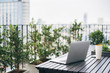 © Lumina Images/Blend Images - Laptop on balcony table