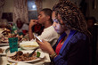 © Granger Wootz/Blend Images - Teenage girl using cell phone at dinner table