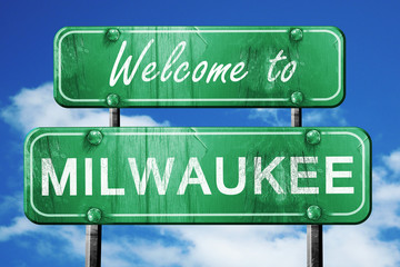 milwaukee vintage green road sign with blue sky background