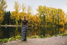 Caucasian Woman Admiring Pond In Park