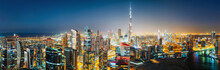 Aerial Panoramic View Of A Big Futuristic City By Night. Business Bay, Dubai, United Arab Emirates. Nighttime Skyline.