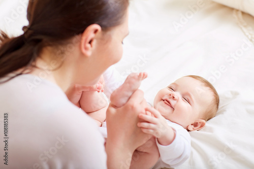 Fotografie, Obraz Mother and baby playing and laughing. A happy family