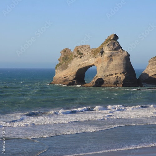 Obraz w ramie Island with a big hole at Wharariki Beach