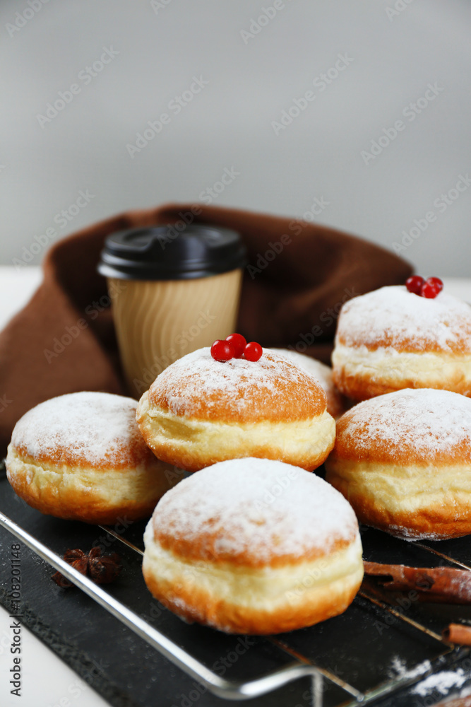 Fresh homemade donuts with powdered sugar, close up