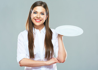 Fototapete - Smiling Business woman  holding emty white plate.