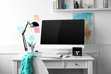 Sticker - Modern wide screen monitor and lamp on white table in room interior