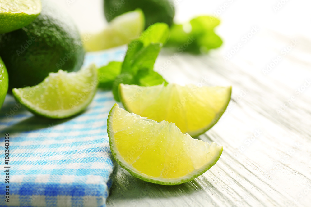 Fresh limes on blue napkin