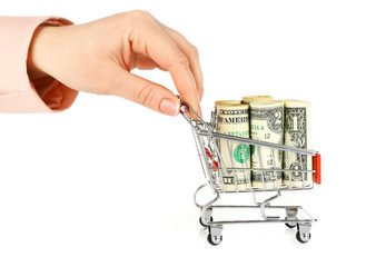 Poster - Woman holding supermarket trolley full of money, isolated on white