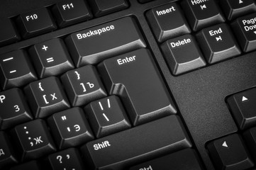 Poster - Electronic collection - black computer keyboard. The focus on the Enter key.