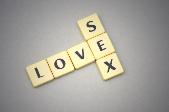 words love and sex on a gray background