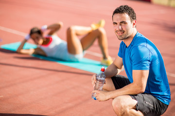 Wall Mural - Woman training with personal trainer