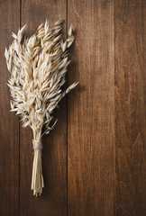 Wall Mural - ears of oat on wood