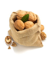 Wall Mural - walnuts in bag on white background