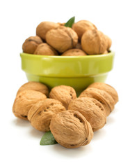 Wall Mural - walnuts in bowl on white