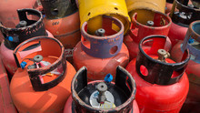 Close Up Image Of Old Empty Industrial Gas Bottles, Cannisters Staked Up