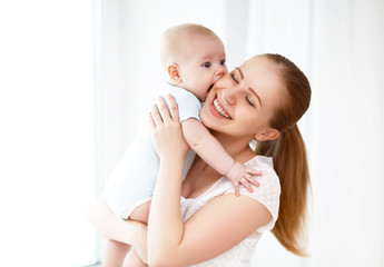 happy family mother playing with baby